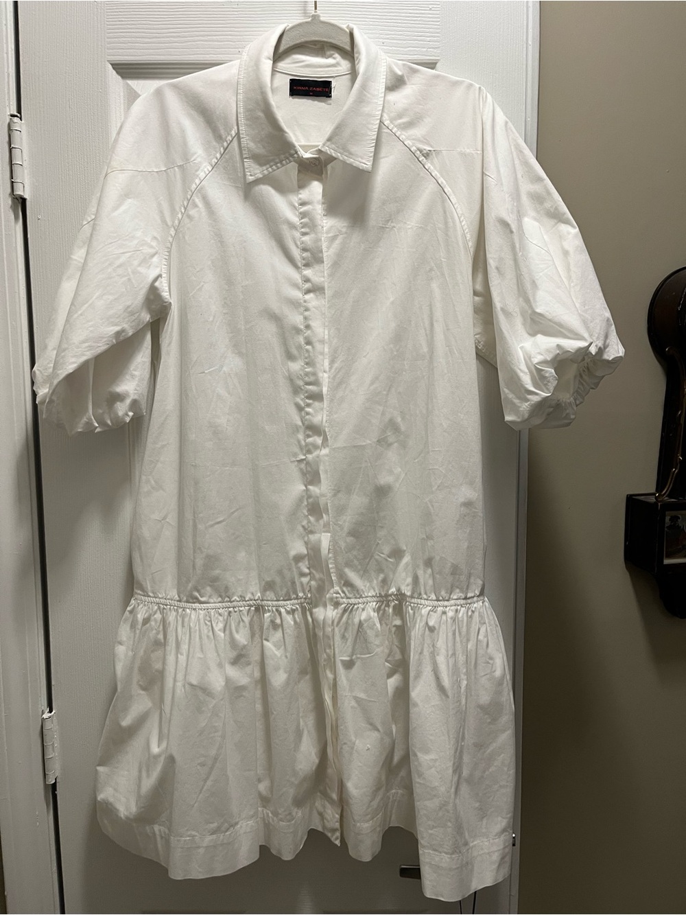 Kirna Zabete White Top Dress with Black Label and Red Lettering. Two pockets
